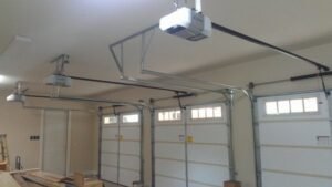 Contemporary black frame glass panel residential garage door installation
