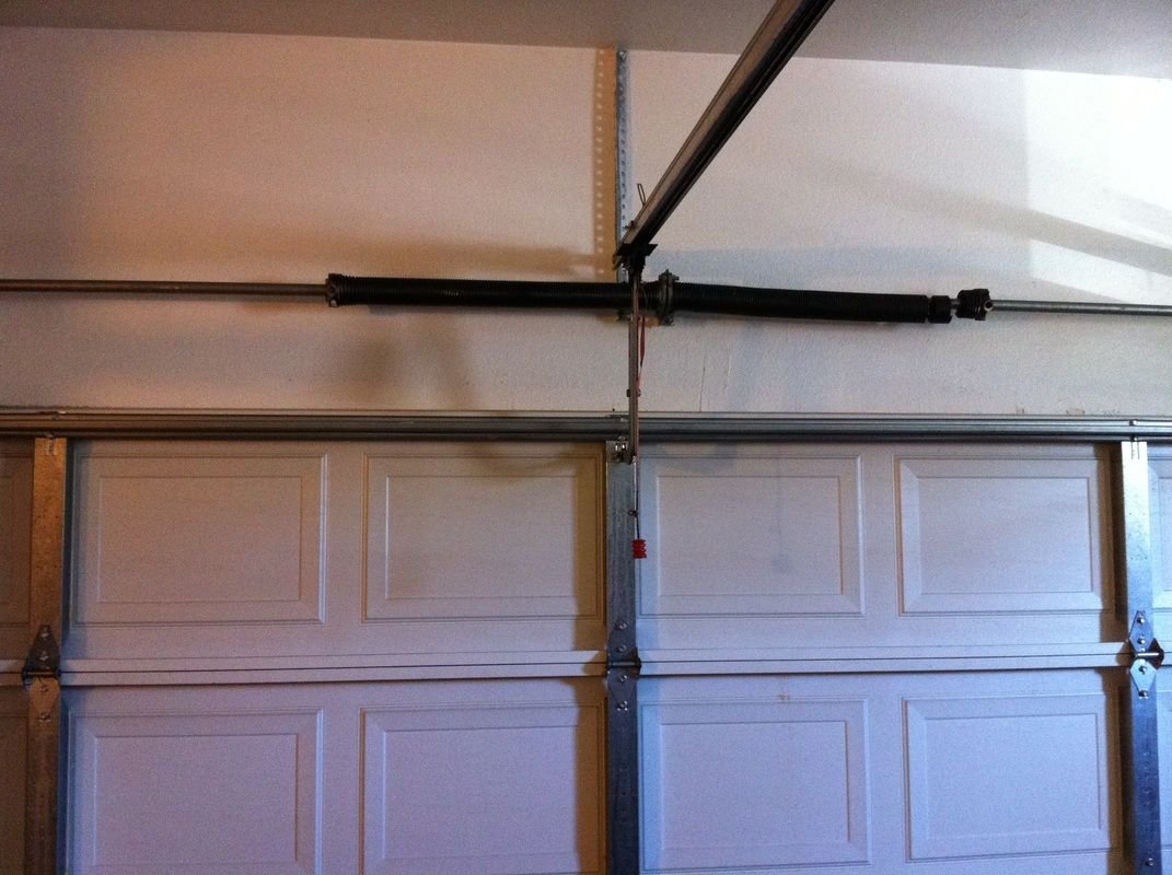 Close up view of oil tempered high cycle commercial garage door spring replacement parts