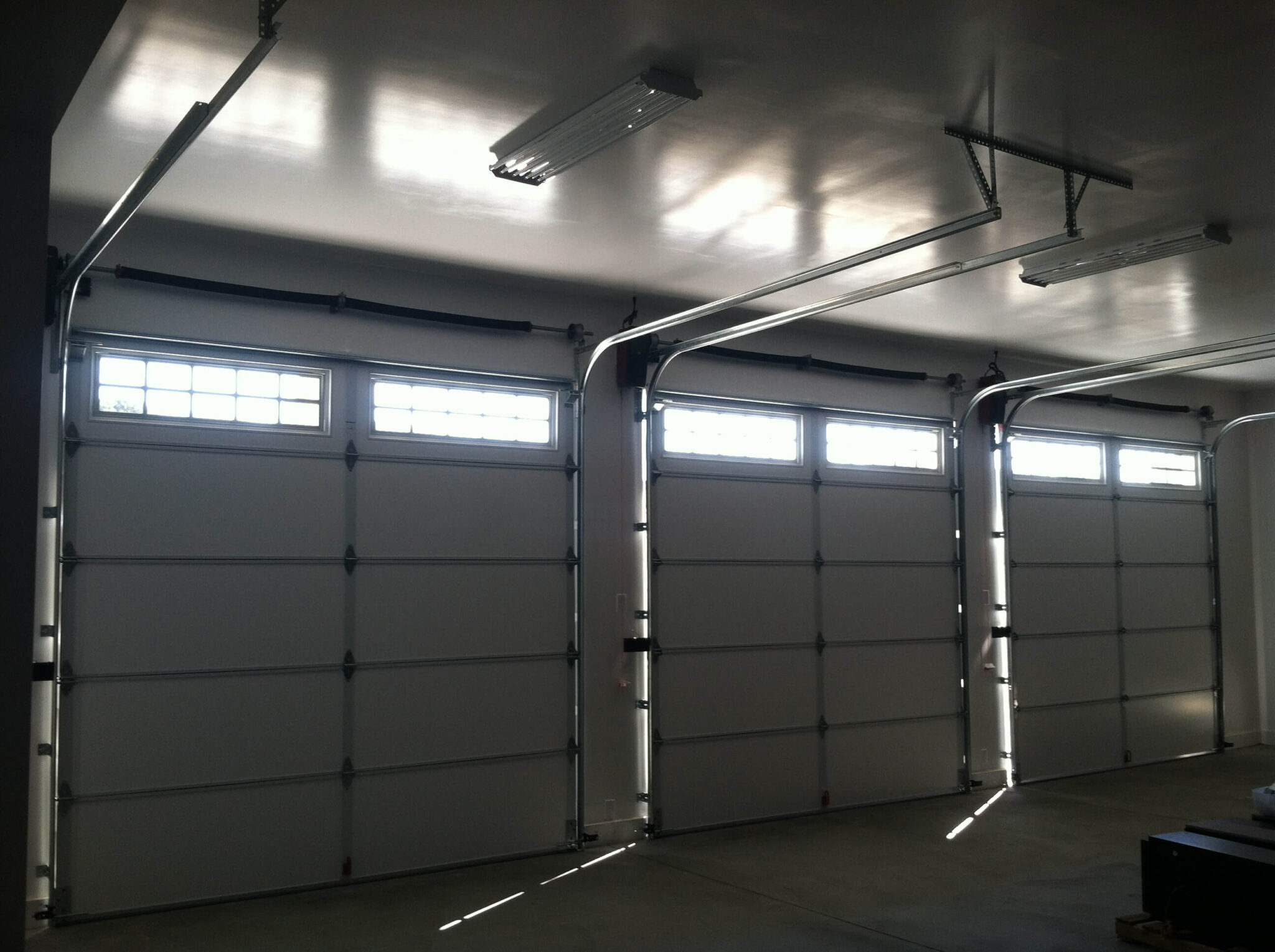 Industrial style heavy structural glass panels overhead installation