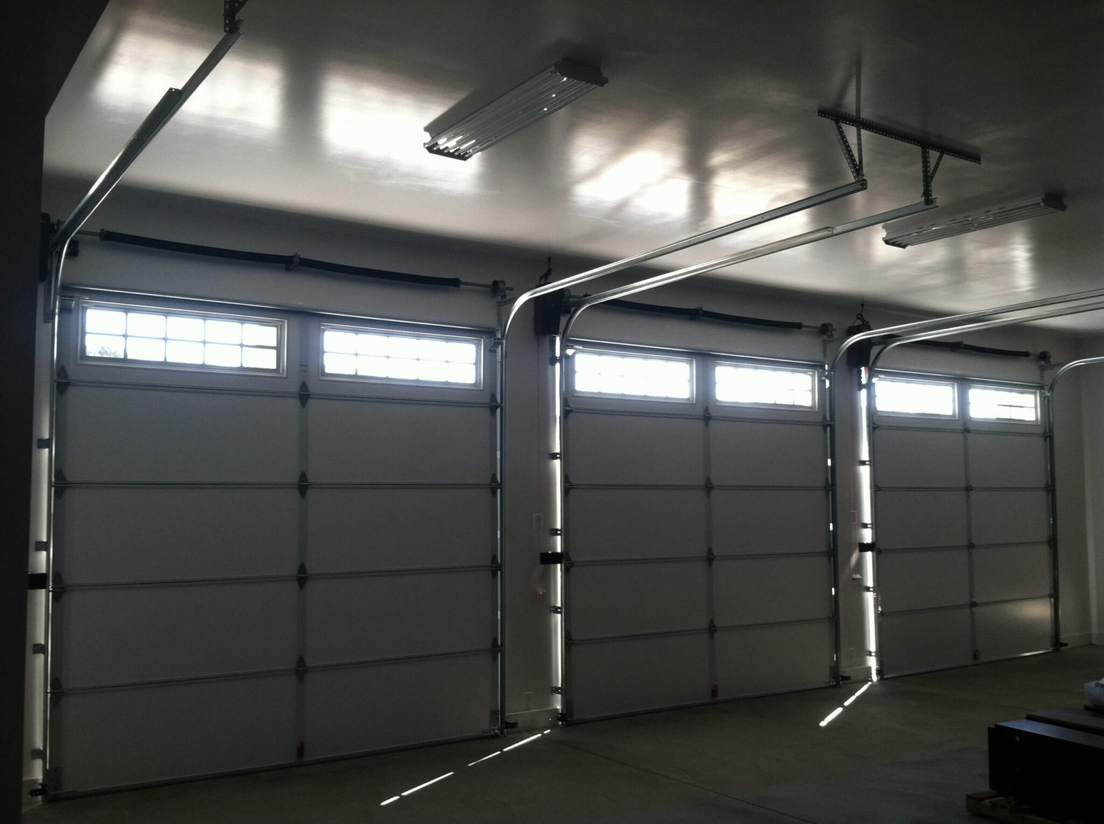 Industrial style heavy structural glass panels overhead installation