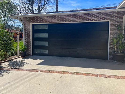 Newly configured premium modern garage door installation showcasing pristine structural architectural alignment
