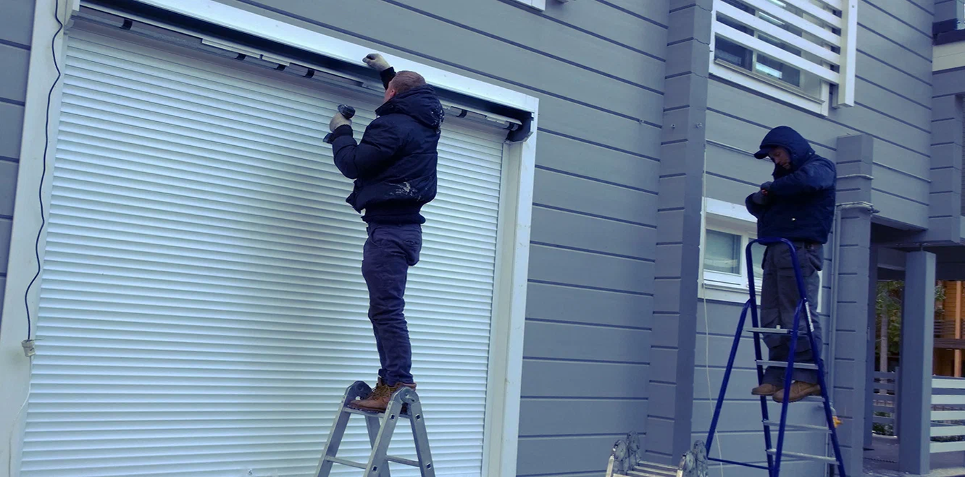 Technical specialist executing detailed garage door repair services on an tracking mechanism