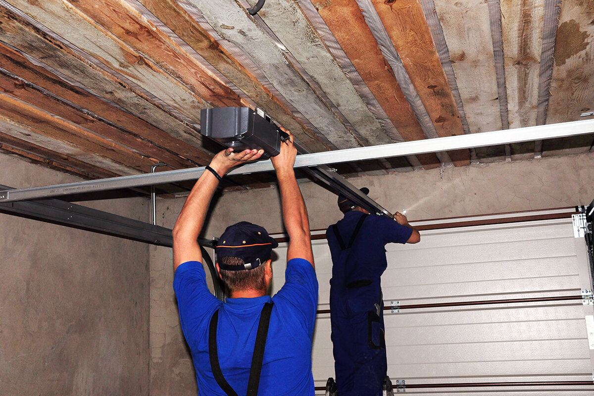 Certified technician repairing a garage door in San Antonio, TX