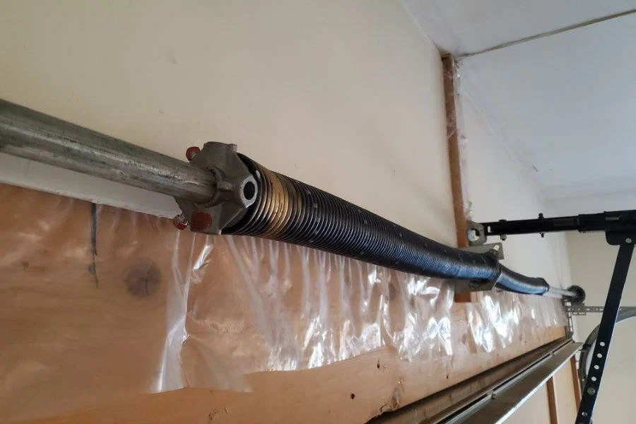New torsion spring installed during a garage door spring replacement