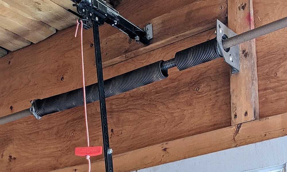 Completed garage door spring replacement, door balanced and tested